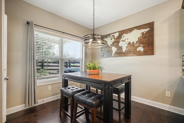 48 Ironwood Ct, Dallas, GA 30132 - dining area with baseboards, a chandelier, and dark wood-type flooring