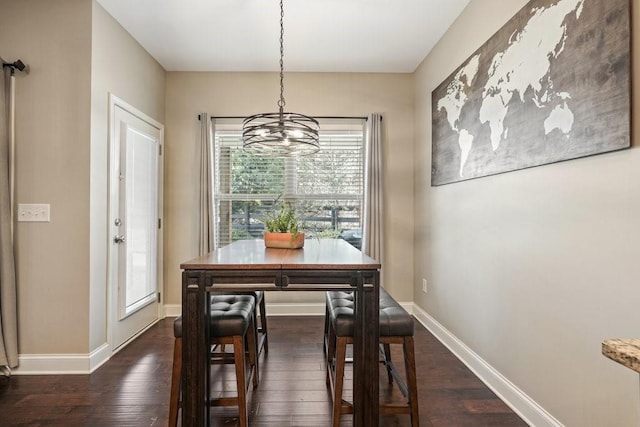 48 Ironwood Ct, Dallas, GA 30132 - dining space featuring dark wood-style flooring, baseboards, and an inviting chandelier