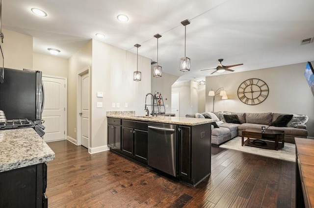 48 Ironwood Ct, Dallas, GA 30132 - kitchen featuring dark wood-style floors, appliances with stainless steel finishes, open floor plan, and a sink