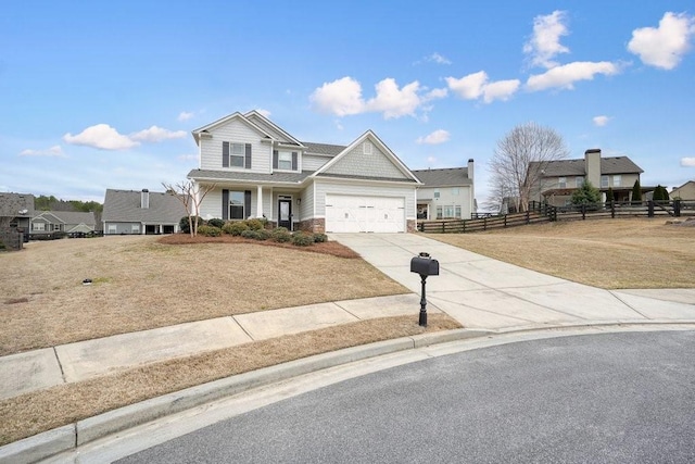 48 Ironwood Ct, Dallas, GA 30132 - traditional-style home with an attached garage, fence, driveway, stone siding, and a front lawn