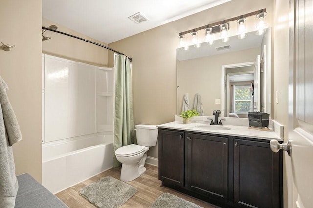 48 Ironwood Ct, Dallas, GA 30132 - bathroom featuring visible vents, toilet, wood finished floors, shower / bathtub combination with curtain, and vanity