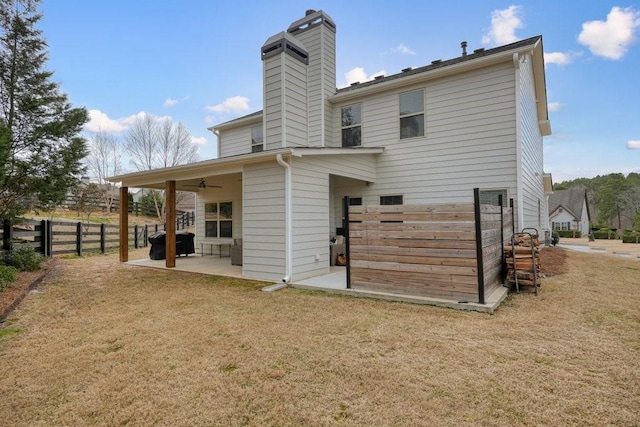 48 Ironwood Ct, Dallas, GA 30132 - back of house with a yard, a chimney, a patio, fence, and ceiling fan