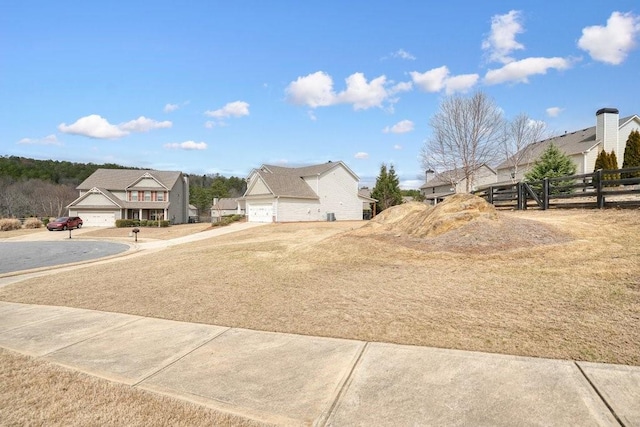48 Ironwood Ct, Dallas, GA 30132 - view of yard featuring a garage, concrete driveway, and fence
