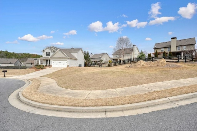 48 Ironwood Ct, Dallas, GA 30132 - view of yard with a garage, driveway, fence, and a residential view
