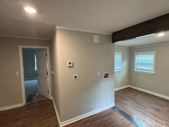 laundry room with dark hardwood / wood-style floors, ornamental molding, washer hookup, and hookup for an electric dryer