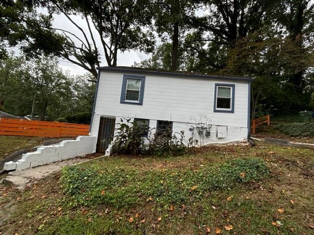 view of home's exterior with a yard