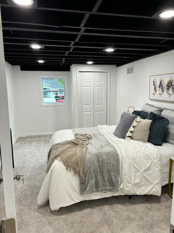 carpeted bedroom featuring a closet