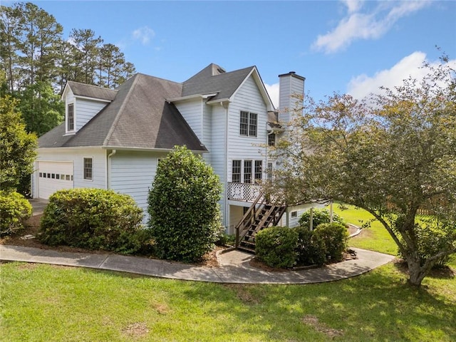 180 Butterfield Ln, Fayetteville, GA 30214 - view of side of home featuring a garage, a yard, stairs, and roof with shingles