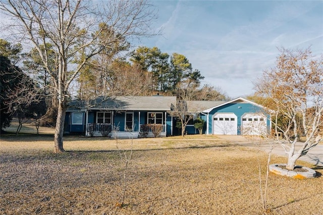 110 Fox Meadow Dr, Covington, GA 30016 - ranch-style house with a front lawn, concrete driveway, covered porch, and a garage