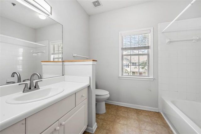 full bath with visible vents, vanity, baseboards, tile patterned floors, and toilet