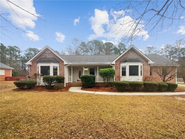 ranch-style home with a front lawn