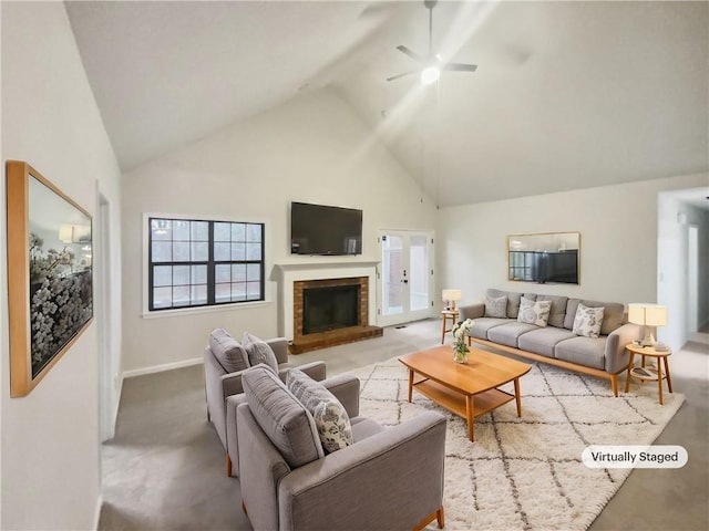 carpeted living room with a fireplace, high vaulted ceiling, and ceiling fan