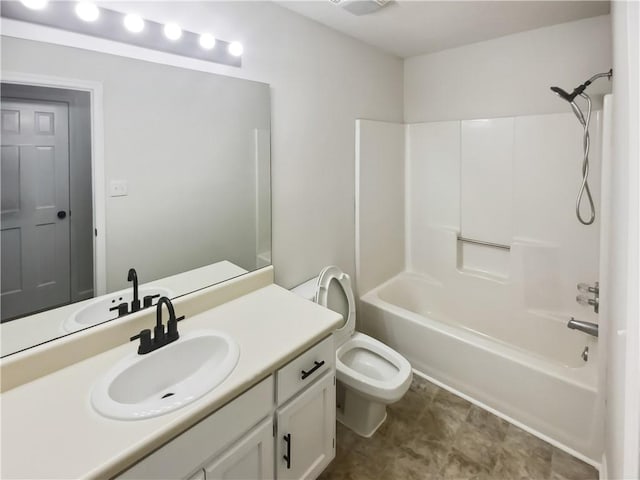 full bathroom featuring vanity, bathing tub / shower combination, and toilet