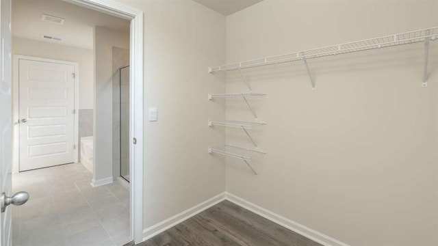 walk in closet featuring hardwood / wood-style floors