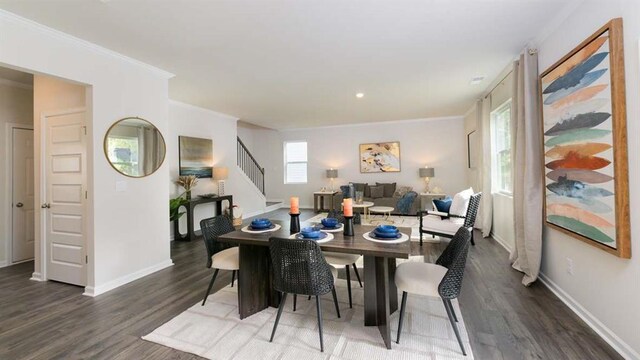 dining room featuring crown molding and dark hardwood / wood-style floors