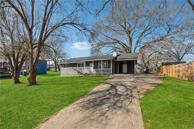 view of front facade featuring a chimney, a porch, aphalt driveway, crawl space, and a front lawn