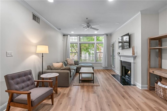 3636 Habersham Rd NW Unit 2101, Atlanta, GA 30305 - living room with ceiling fan, recessed lighting, a premium fireplace, ornamental molding, and light wood-style floors