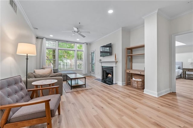 3636 Habersham Rd NW Unit 2101, Atlanta, GA 30305 - living area with crown molding, ceiling fan, recessed lighting, light wood-style floors, and a premium fireplace