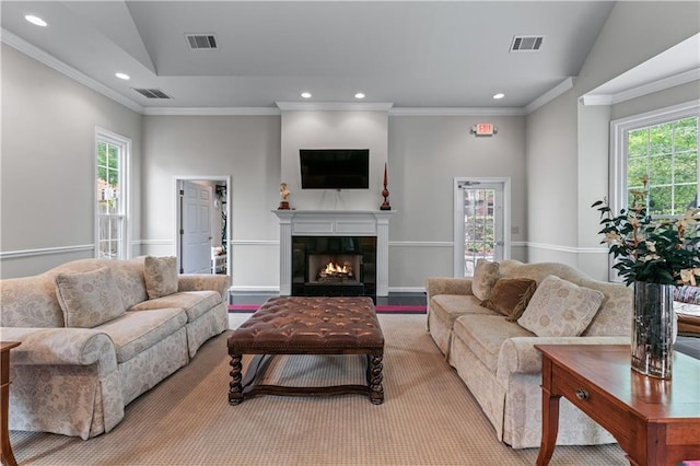 3636 Habersham Rd NW Unit 2101, Atlanta, GA 30305 - living room featuring recessed lighting, healthy amount of natural light, a glass covered fireplace, and crown molding