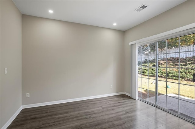 empty room with hardwood / wood-style flooring