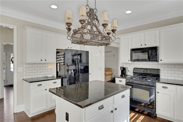 kitchen with black appliances, dark wood-style floors, crown molding, and white cabinetry