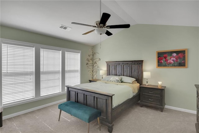 bedroom featuring visible vents, baseboards, lofted ceiling, light colored carpet, and ceiling fan