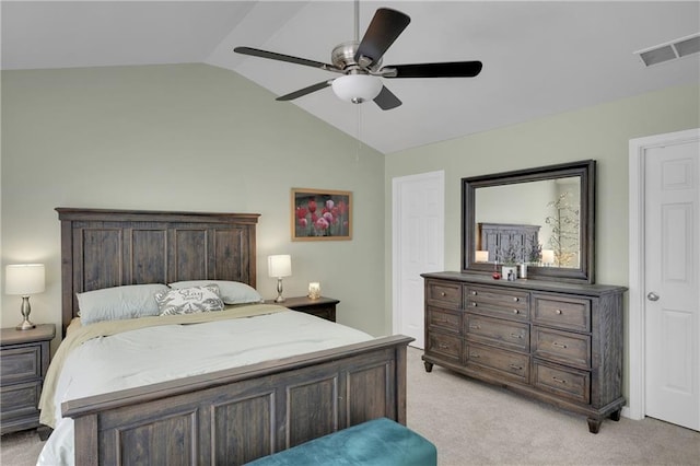 bedroom featuring light carpet, visible vents, a ceiling fan, and vaulted ceiling