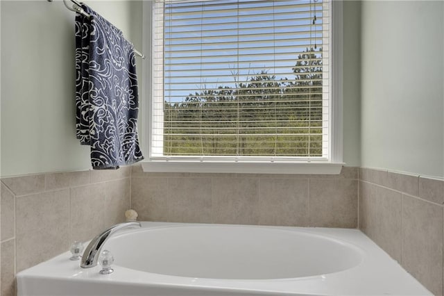 bathroom with plenty of natural light and a garden tub