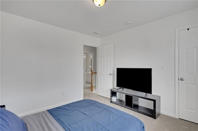 carpeted bedroom with baseboards