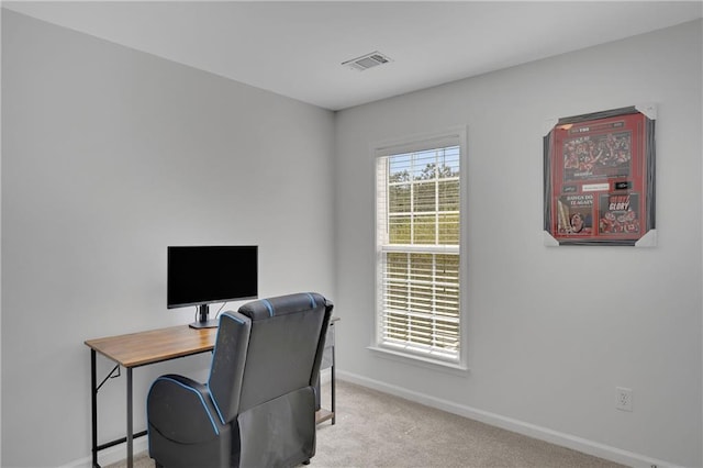 office space featuring visible vents, baseboards, and carpet floors