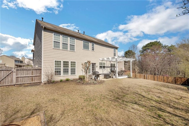 rear view of property with a patio area, a yard, a fenced backyard, and a pergola