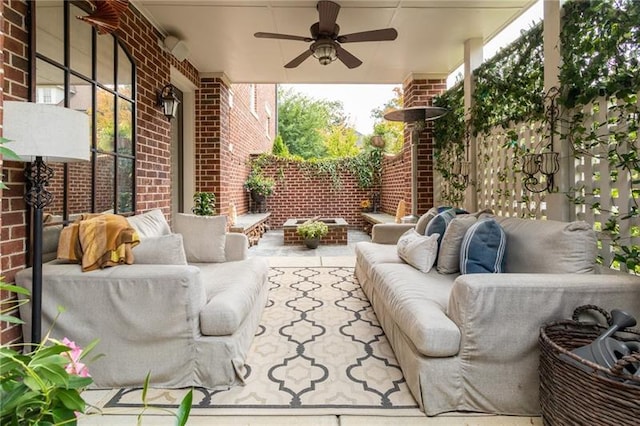 view of patio with ceiling fan and an outdoor living space