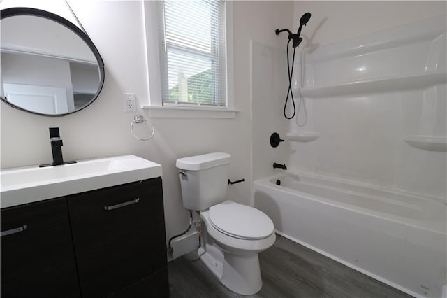 full bathroom featuring vanity, toilet, shower / bathing tub combination, and hardwood / wood-style flooring