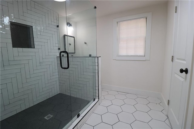 bathroom featuring tile patterned flooring and a shower with door