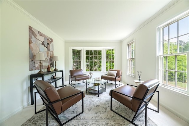 sitting room with baseboards, plenty of natural light, ornamental molding, and light carpet