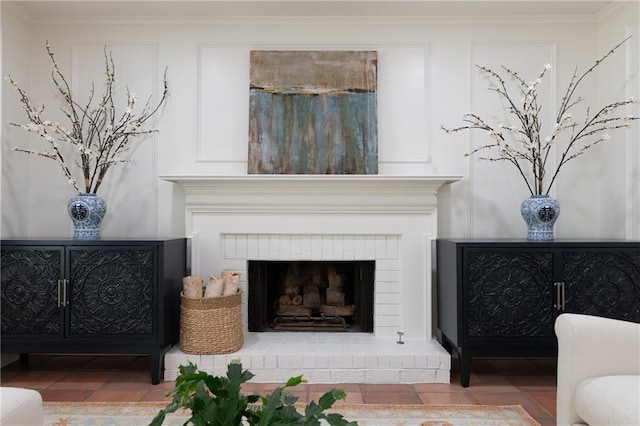 details with ornamental molding and a fireplace