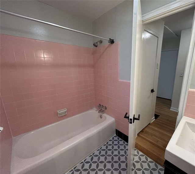779 Casplan St SW, Atlanta, GA 30310 - full bathroom with tile walls, tile patterned floors, vanity, and shower / washtub combination