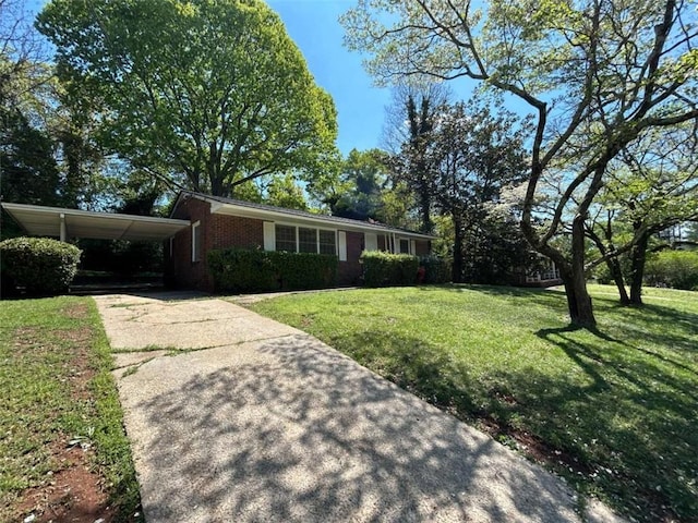 779 Casplan St SW, Atlanta, GA 30310 - single story home featuring brick siding, a front yard, concrete driveway, and an attached carport