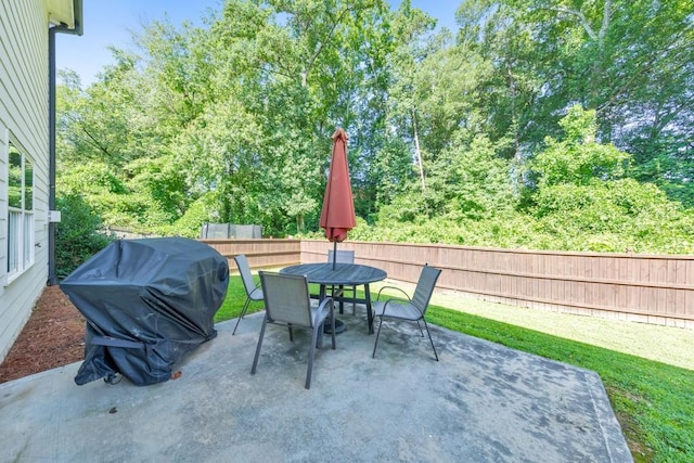 4230 Old Cherokee St, Acworth, GA 30101 - fenced backyard with a patio and outdoor dining area
