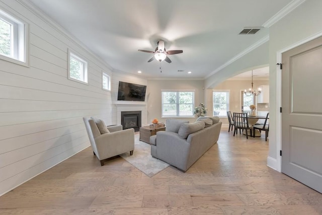4230 Old Cherokee St, Acworth, GA 30101 - living area with a chandelier, ornamental molding, a glass covered fireplace, recessed lighting, and ceiling fan