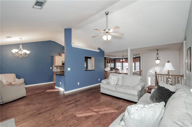 living room with ceiling fan with notable chandelier, visible vents, baseboards, vaulted ceiling, and dark wood finished floors