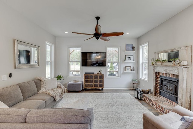 living room with hardwood / wood-style floors and ceiling fan