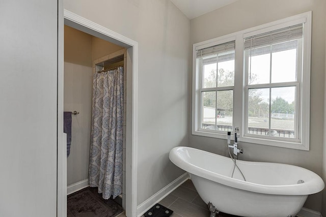 bathroom with tile patterned flooring and plus walk in shower