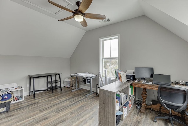 office area featuring hardwood / wood-style flooring, ceiling fan, and vaulted ceiling