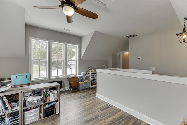 office featuring lofted ceiling, wood-type flooring, and ceiling fan