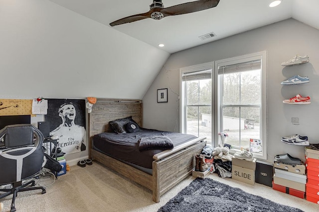 bedroom featuring carpet, ceiling fan, and vaulted ceiling