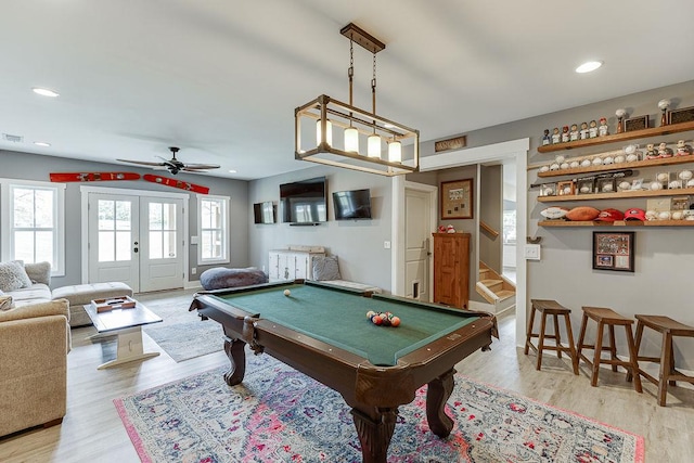 game room with pool table, french doors, ceiling fan, and light hardwood / wood-style flooring