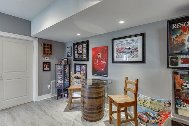 bar featuring light hardwood / wood-style flooring