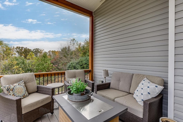 wooden terrace featuring outdoor lounge area