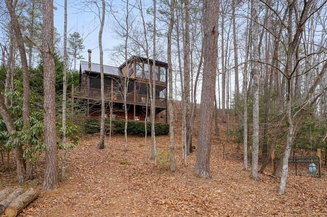 back of property with a wooden deck